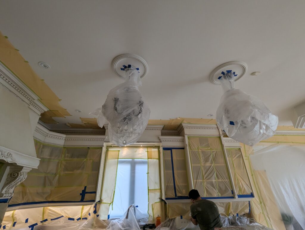 kitchen masked with plastic to protect from overspray